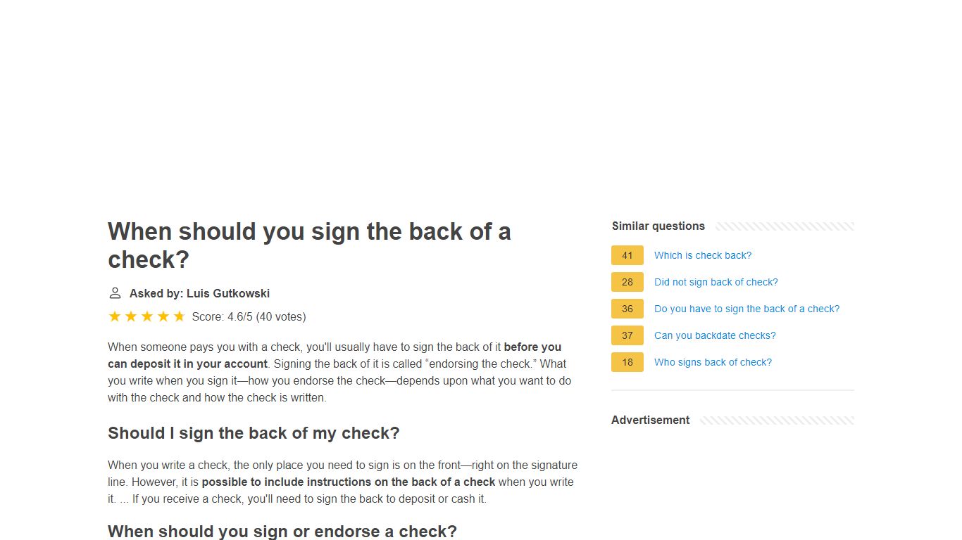 When should you sign the back of a check?